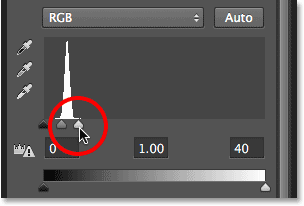 Dragging the white point slider towards the left. Image © 2013 <a href='https://www.86ps.com/'><font color=''>Photoshop</font></a> Essentials.com