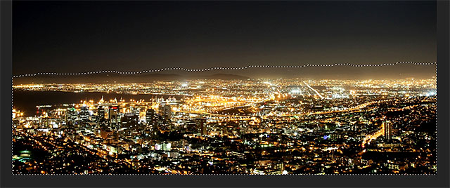Selecting the city and mountain range with the Lasso Tool in <a href='https://www.86ps.com/'><font color=''>Photoshop</font></a>. Image © 2013 <a href='https://www.86ps.com/'><font color=''>Photoshop</font></a> Essentials.com